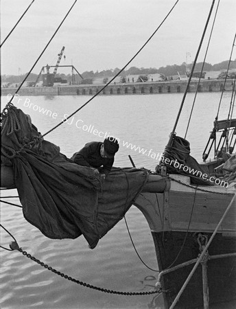 DOCKS SAILOR ON BOWSPRIT